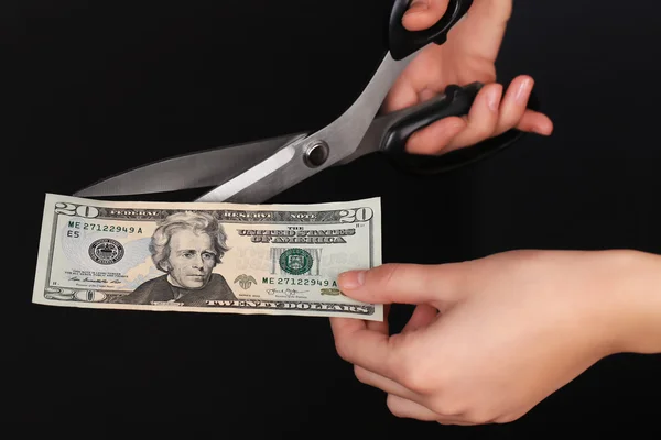 Hands with scissors cutting dollar — Stock Photo, Image