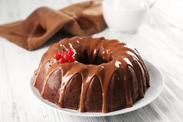 Chocolate cake with a bottle of milk on a table — Stock Photo, Image