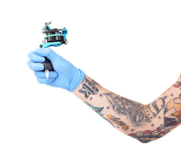 Mano nel guanto con macchina tatuaggio — Foto Stock