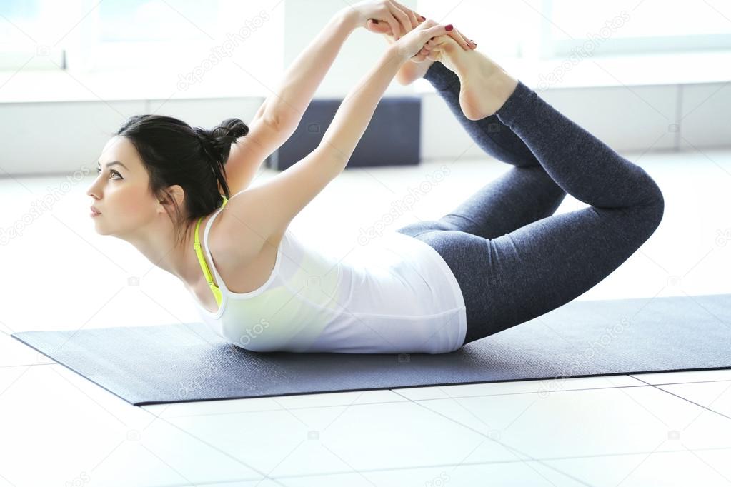 Woman does yoga exercise 