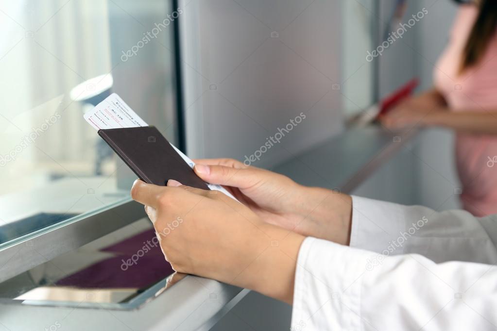 Woman buying tickets 