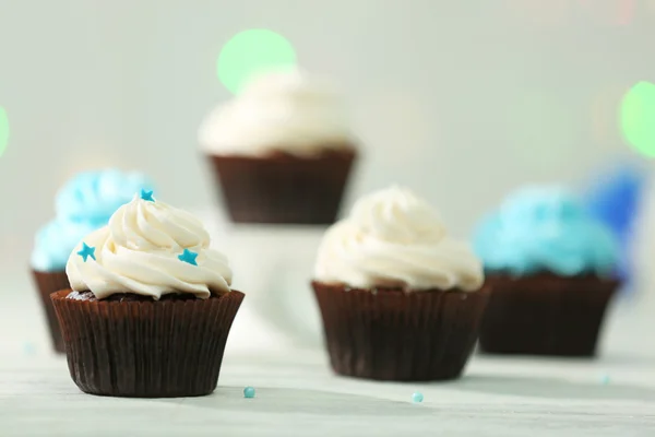 Chocolate cupcakes on a table — Stock Photo, Image