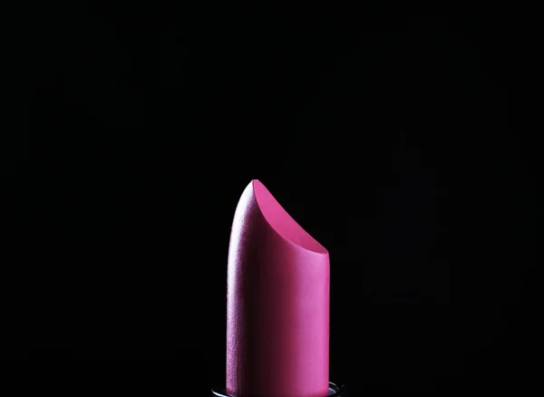 Lápiz labial rosa sobre negro —  Fotos de Stock