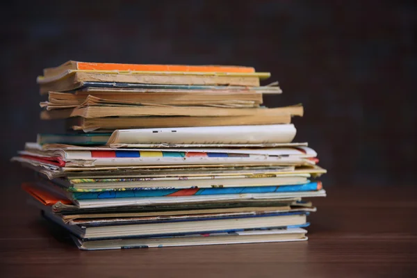Pile of old books on wooden table — Stock Photo, Image