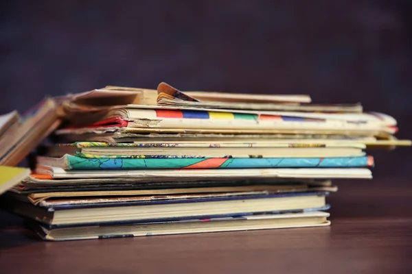 Pile of old books on wooden table — Stock Photo, Image