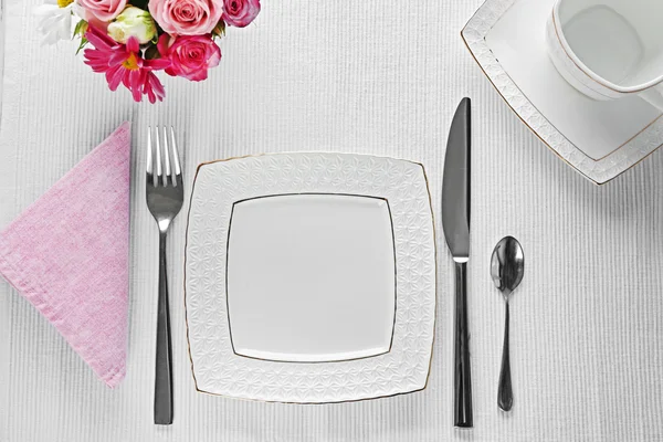 Table setting with dishes — Stock Photo, Image