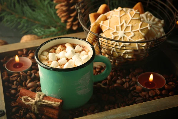 Mug of hot cacao with marshmallow and cookies on coffee beans — Stock Photo, Image