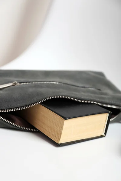 Fashion female handbag with book — Stock Photo, Image