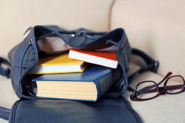 Female backpack with book — Stock Photo, Image