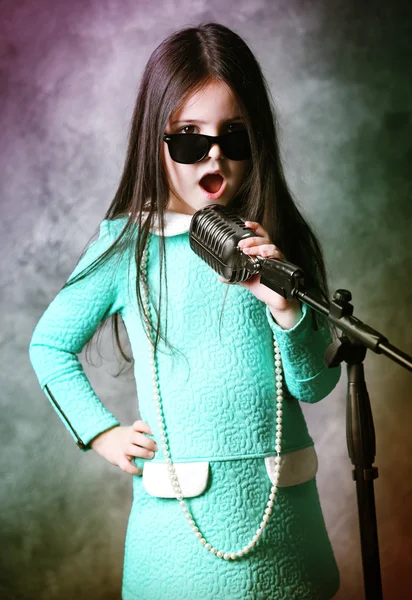 Super-star girl with microphone