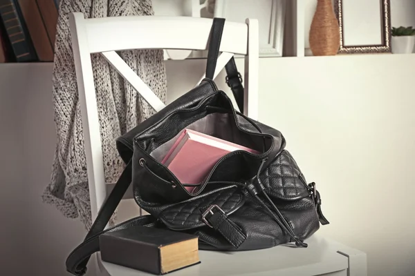 Female backpack with book — Stock Photo, Image