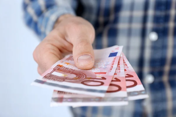 Man holding euros — Stock Photo, Image