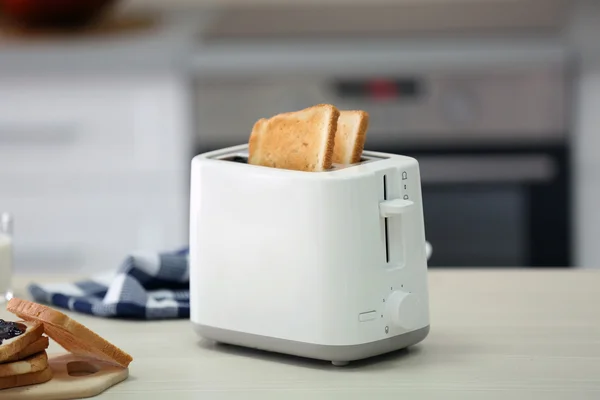 Toaster with dishes and sandwiches