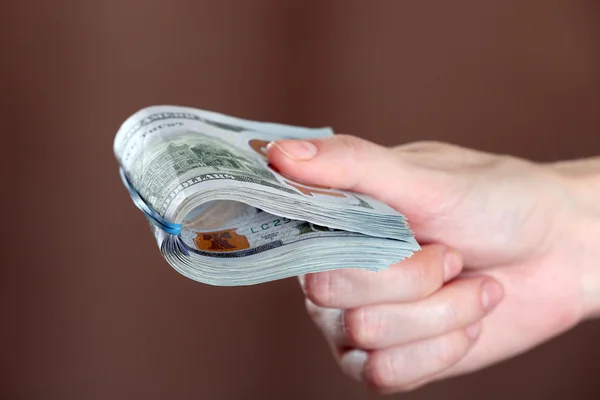 Hand holds money — Stock Photo, Image