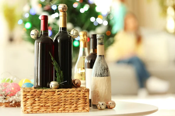 Wine in wicker box and Christmas decor