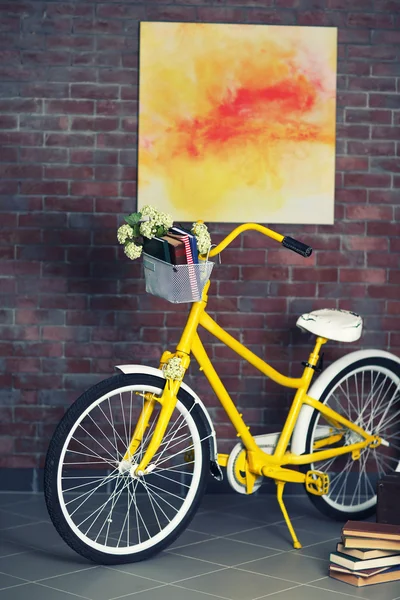 Yellow bicycle with books — Stock Photo, Image