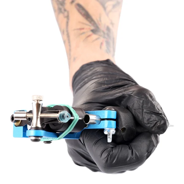 Dłoń w rękawicy z maszynka do tatuażu — Zdjęcie stockowe