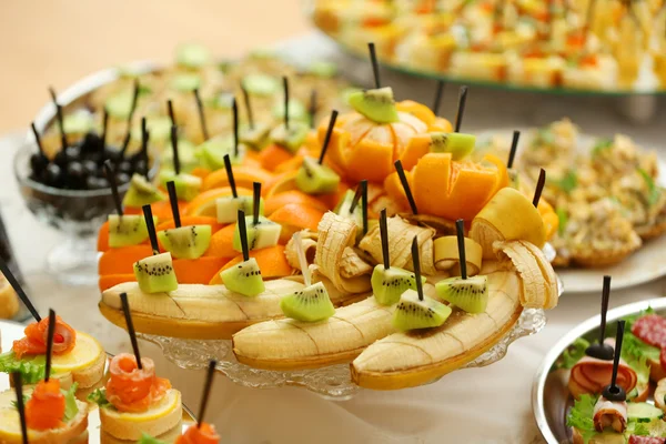 Dish with assorted snacks on a table — Stock Photo, Image