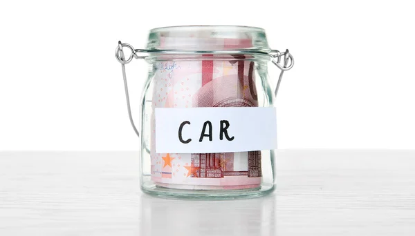 Jar for savings full of banknotes — Stock Photo, Image