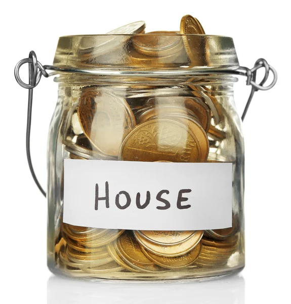 Glass jar with coins for house — Stock Photo, Image