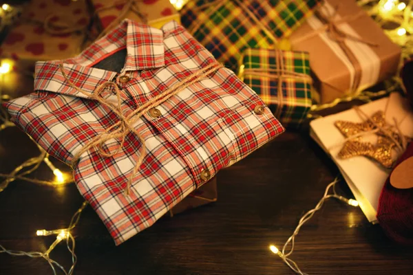 Checkered shirt with Christmas gifts — Stock Photo, Image