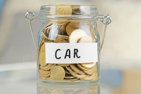 Glass jar with Ukrainian coins — Stock Photo, Image