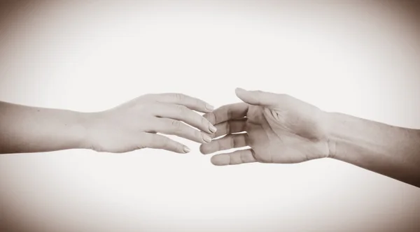 Hands reaching toward each other — Stock Photo, Image