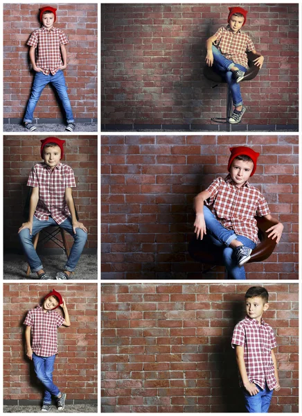 Lindo niño en la pared de ladrillo — Foto de Stock