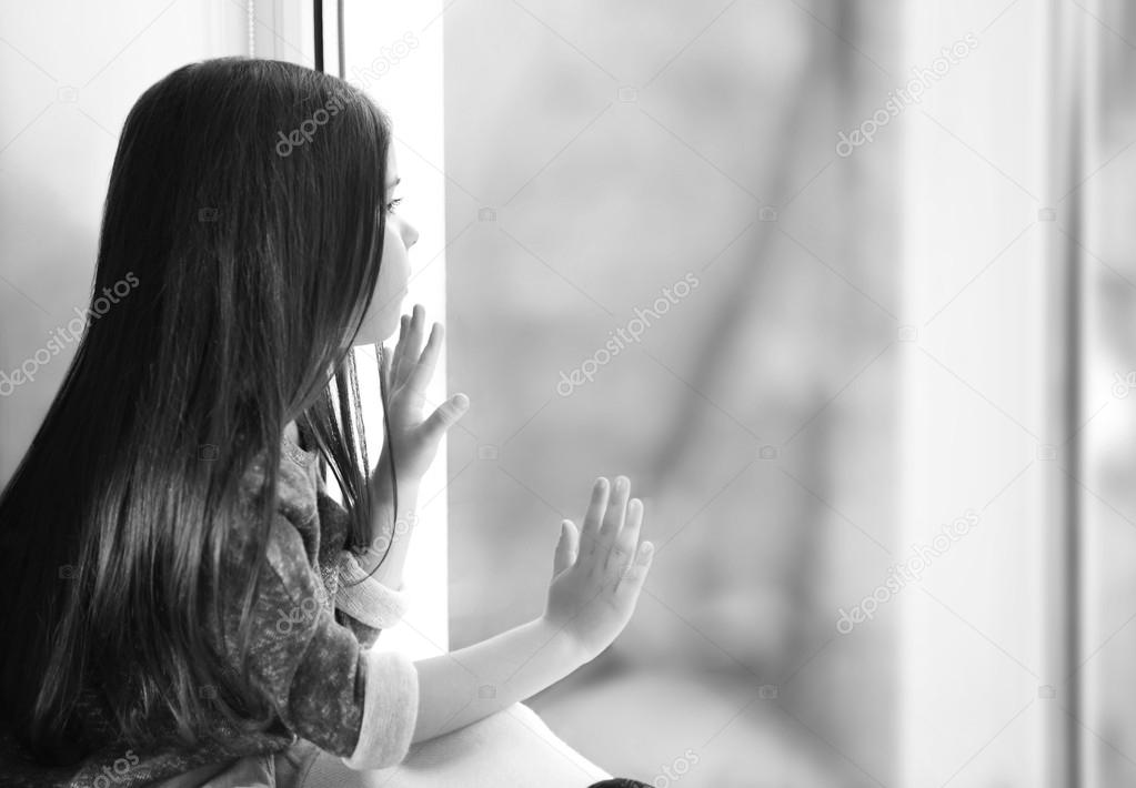 Little girl waiting for someone