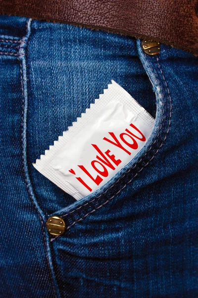 Condom in pocket of jeans — Stock Photo, Image