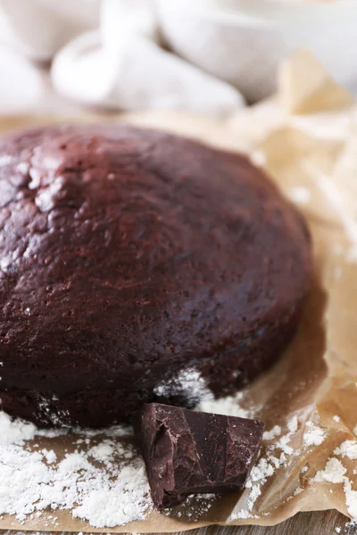 Home made chocolate pie on craft paper — Stock Photo, Image