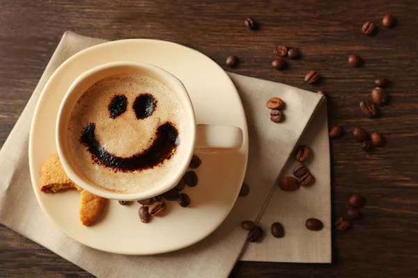 Cup of coffee on wooden table background — Stock Photo, Image