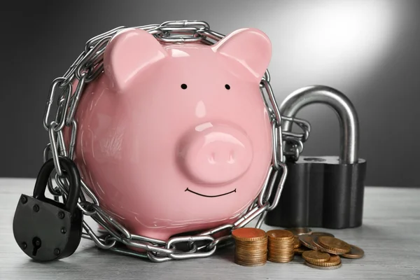 Piggy bank and chains — Stock Photo, Image