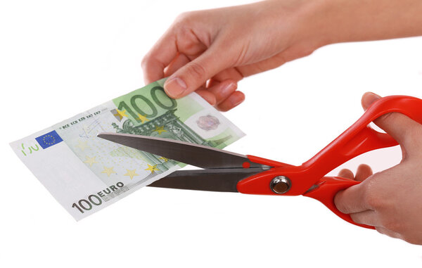 Hands with scissors cutting Euro