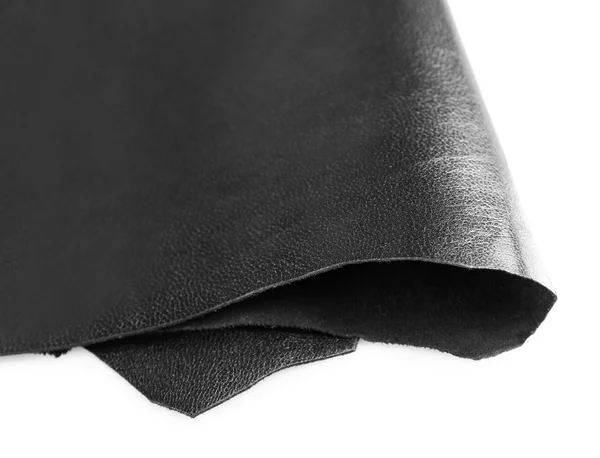 Black shiny leather texture on white background, close up — Stock Photo, Image