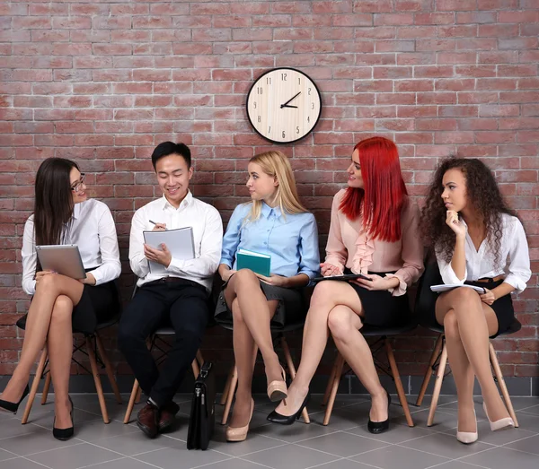 People sitting on chairs — Stock Photo, Image