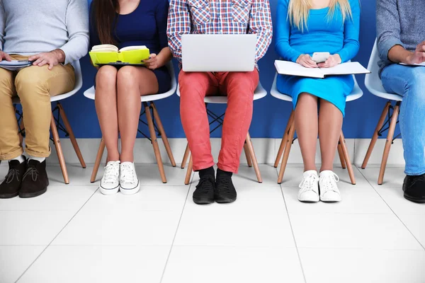 People sitting on chairs — Stock Photo, Image