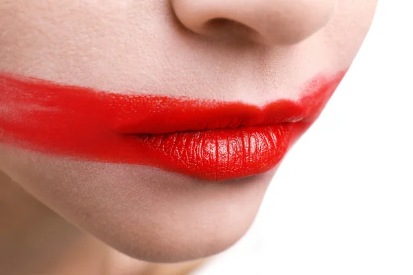 Woman\'s face with smeared  lipstick