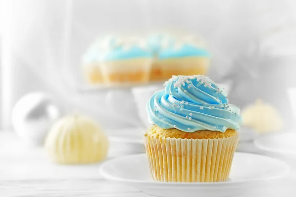 Tasty blue cupcake with candle and decorations, closeup — Stock Photo, Image