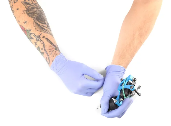 Mãos de tatuador em luvas azuis — Fotografia de Stock
