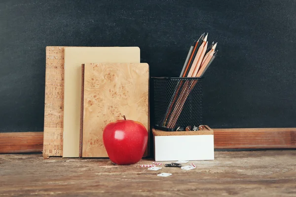 School supplies on old wooden table — Stock Photo, Image