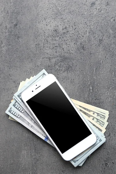 Mobile phone and money — Stock Photo, Image