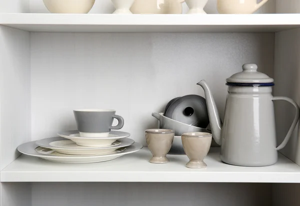 Tableware on shelves in the kitchen — Stock Photo, Image