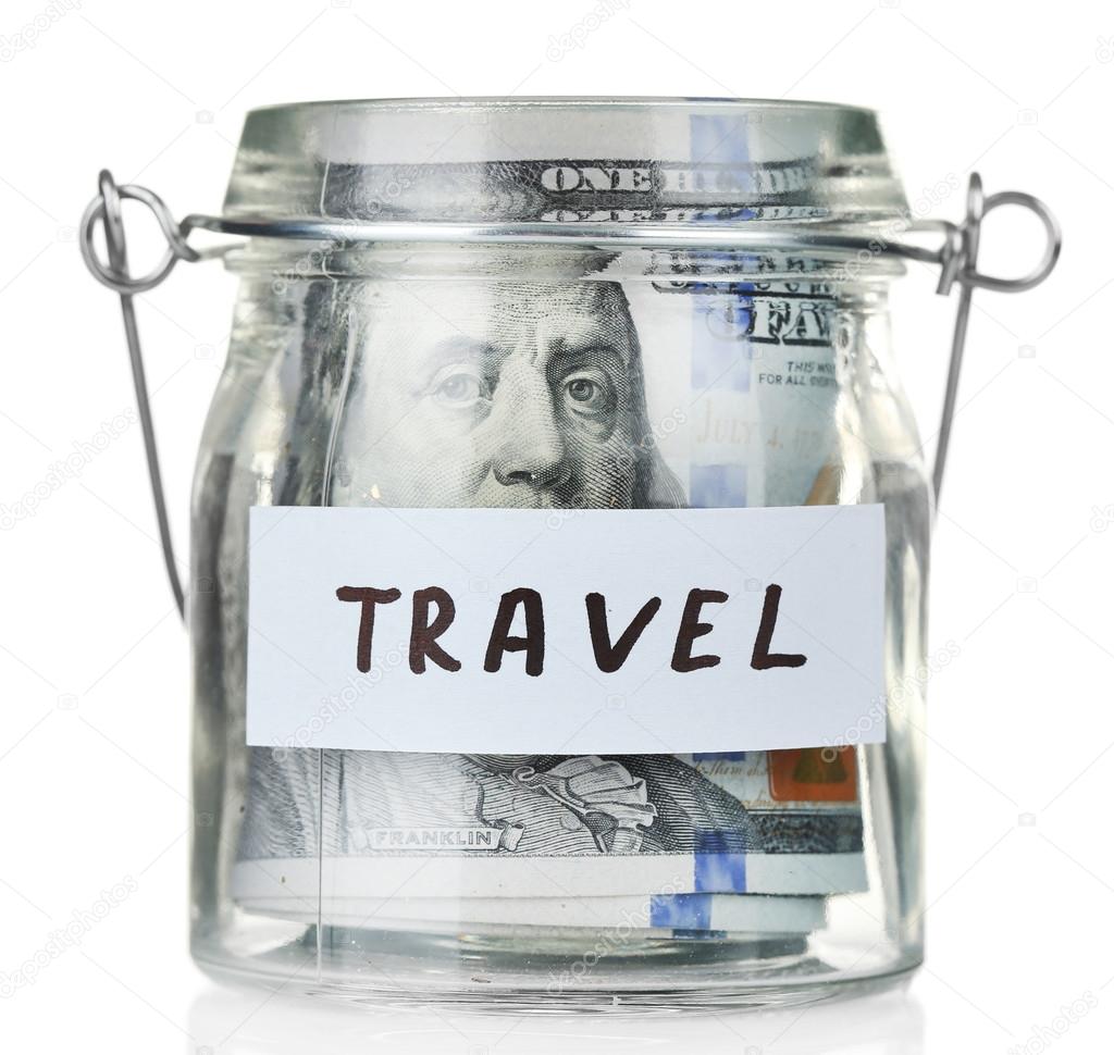 Glass jar with dollar banknotes for travel, isolated on white