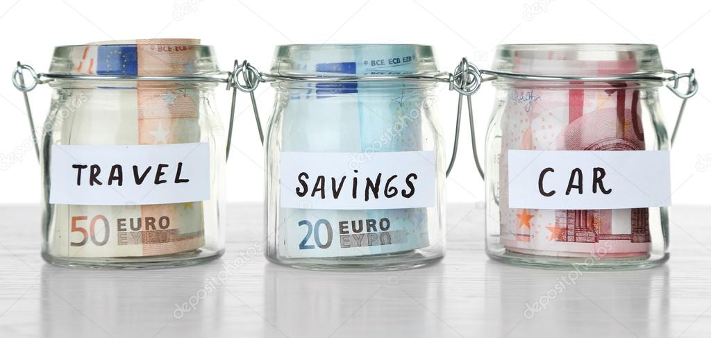 Three jars for different needs full of coins