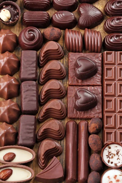 Ποικιλία από νόστιμα σοκολάτας καραμέλες φόντο, κοντινό πλάνο — Φωτογραφία Αρχείου