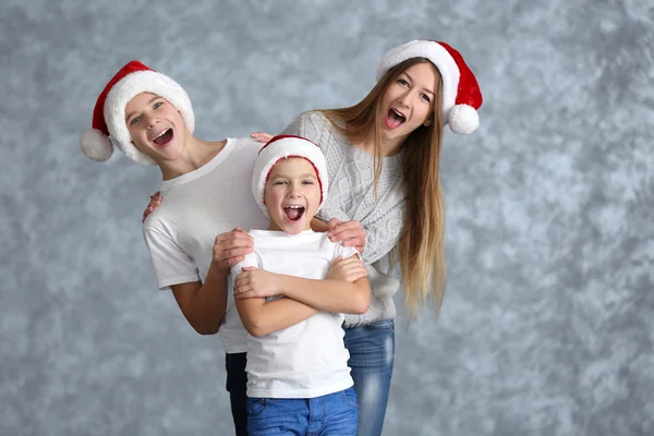 Boys and girl in Santa hats — Stock Photo, Image
