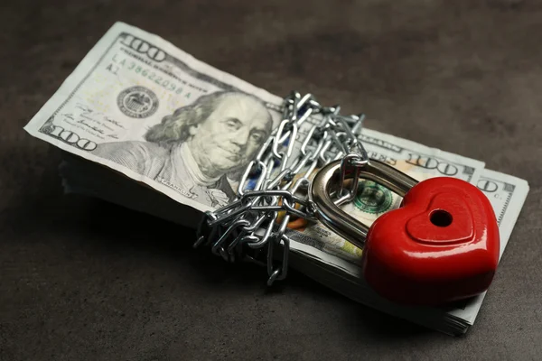 Dollars currency with lock and chain on gray  background — Stock Photo, Image