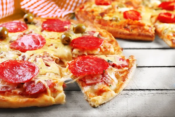 Delicious tasty pizza with cut slice, closeup — Stock Photo, Image