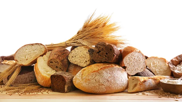 Fresh baked bread and wheat ears, isolated on white — Stock Photo, Image